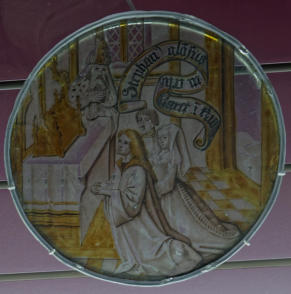 Donateurs agenouillés devant un autel